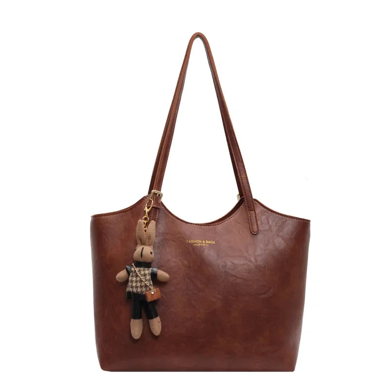 Thalessa | Chic Leather Tote Bag with Playful Charm – Elegance Meets Fun