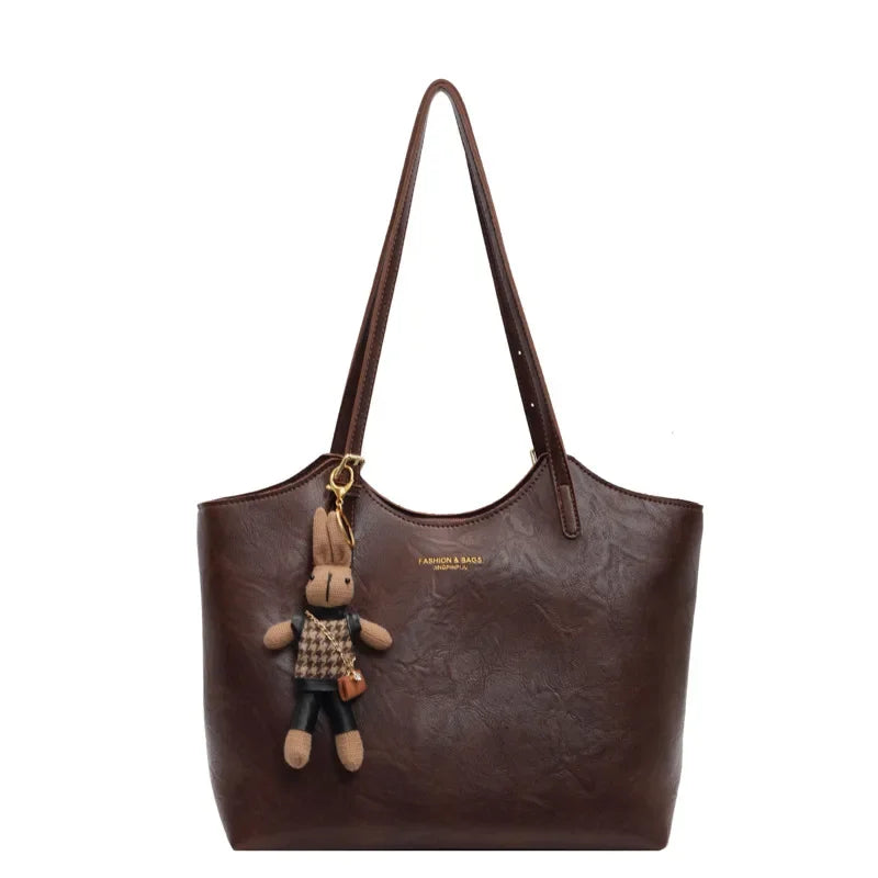 Thalessa | Chic Leather Tote Bag with Playful Charm – Elegance Meets Fun