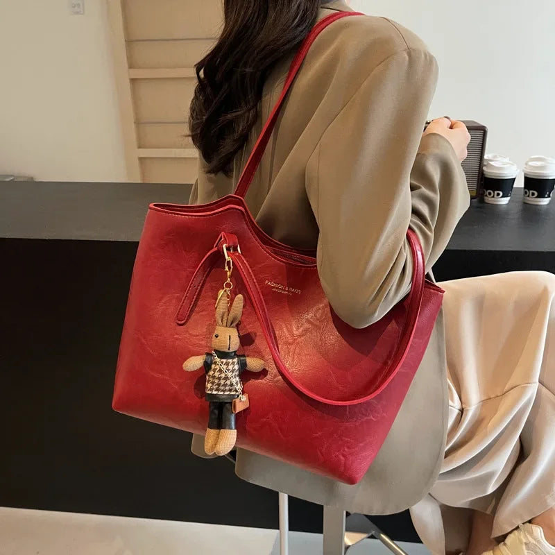 Thalessa | Chic Leather Tote Bag with Playful Charm – Elegance Meets Fun