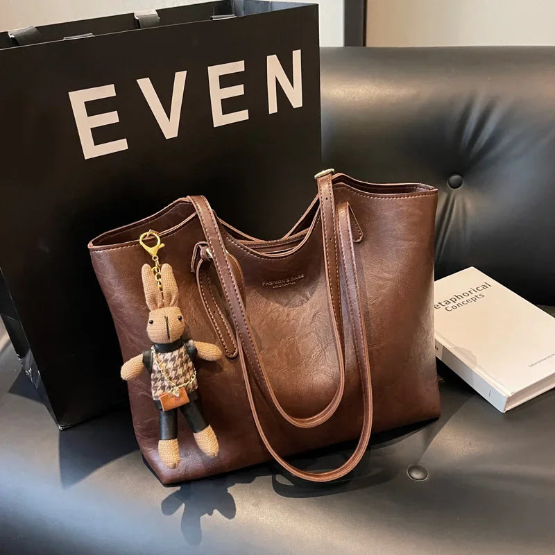 Thalessa | Chic Leather Tote Bag with Playful Charm – Elegance Meets Fun