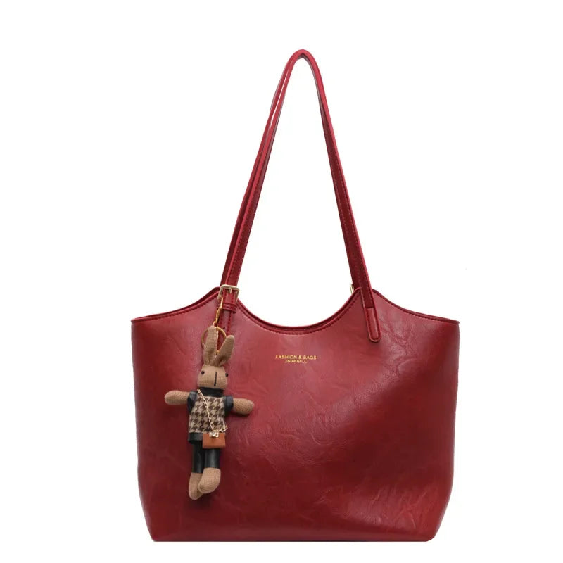 Thalessa | Chic Leather Tote Bag with Playful Charm – Elegance Meets Fun