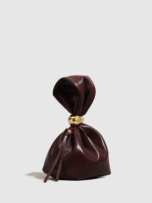 Eryndra | Burgundy Vegan Leather Knot Clutch – Modern & Elegant